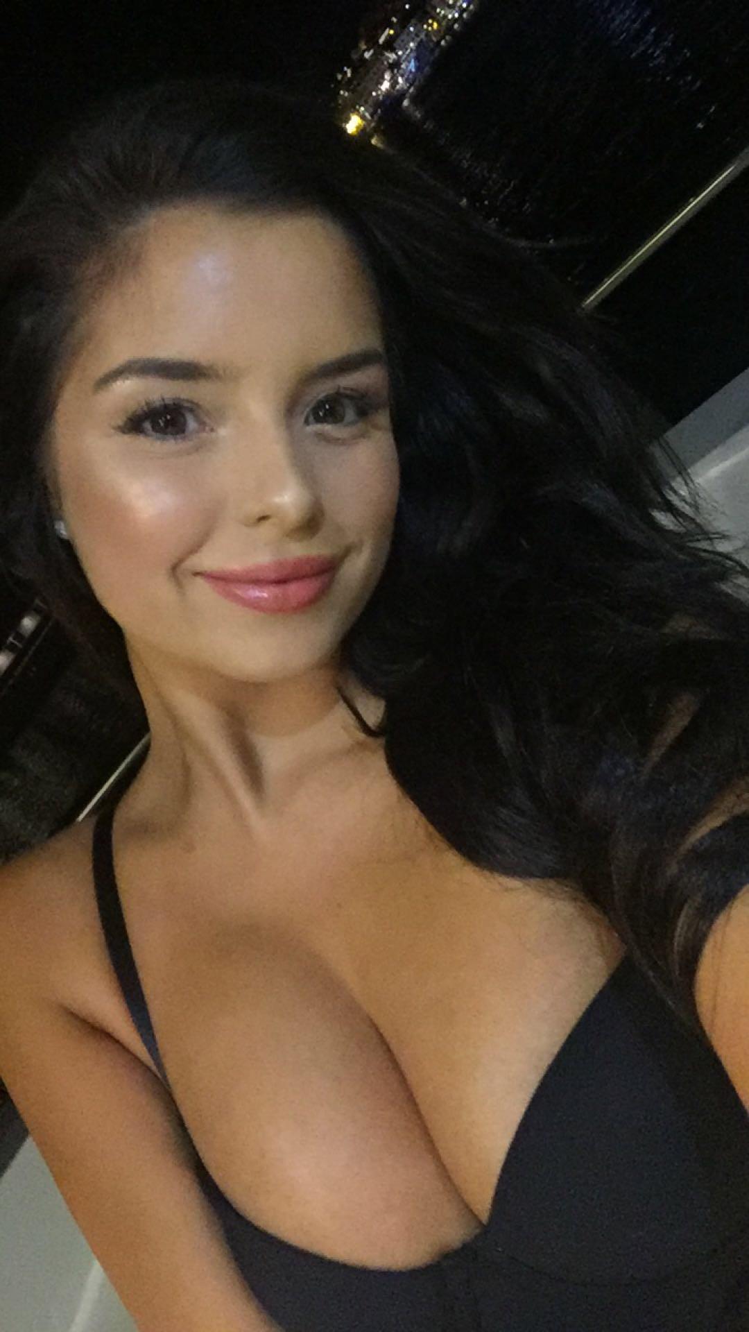 Demi Rose Mawby in a bikini taking a selfie