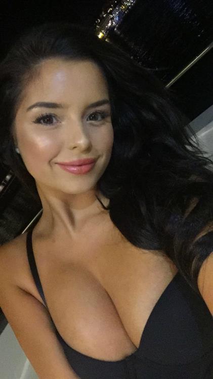 Demi Rose Mawby in a bikini taking a selfie