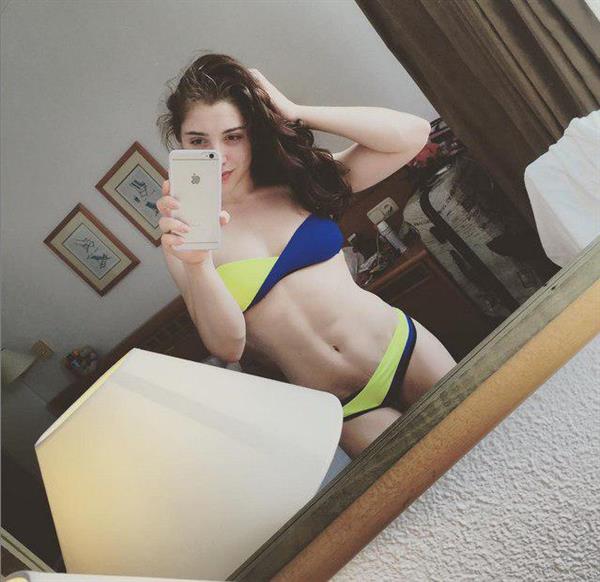 Aliya Mustafina in a bikini taking a selfie