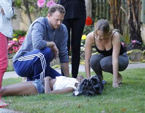 Jennifer Lawrence in Santa Monica helping a woman who fainted on June 25, 2012 