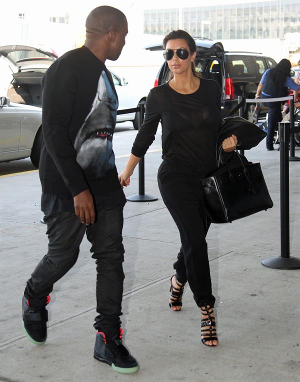 Kim Kardashian and Kanye West JFK airport in New York - 09 August 2012 
