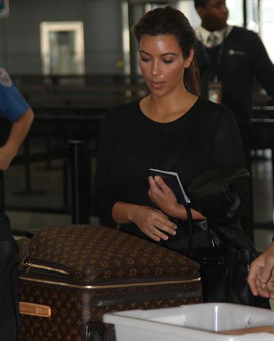 Kim Kardashian and Kanye West JFK airport in New York - 09 August 2012 