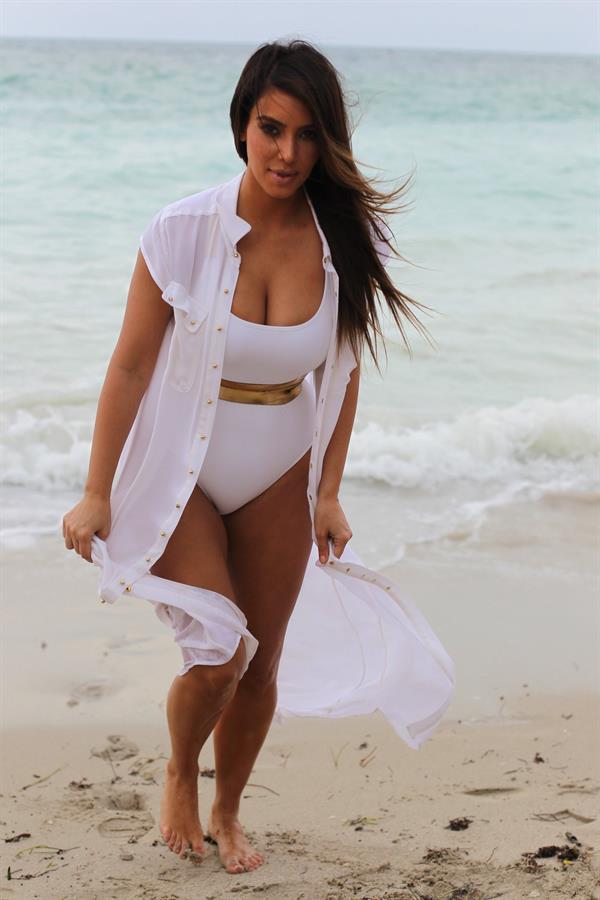 Kim Kardashian in a swimsuit at Miami beach 9/24/12