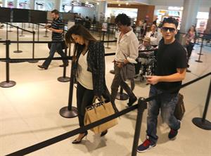 Kim Kardashian catches a flight out of Miami October 4, 2012 