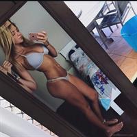 Jade Grobler in a bikini taking a selfie