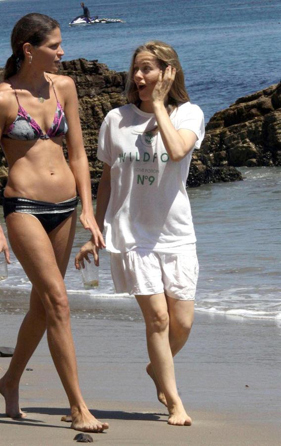 Alicia Silverstone walking on the beach in Malibu 