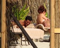 Amy Childs sunbathing with Peter Andre in Dubai on January 3, 2012