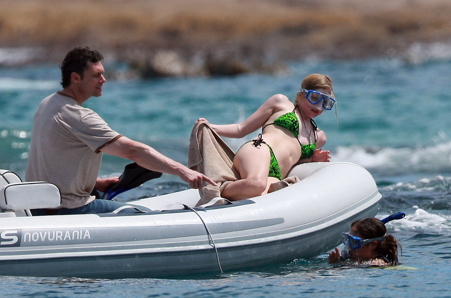 Avril Lavigne in a green bikini in Cabo, Mexico on July 27, 2012