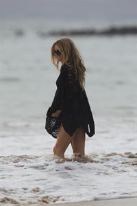 Carmen Electra – beach shoot candids in Hawaii 10/3/13  