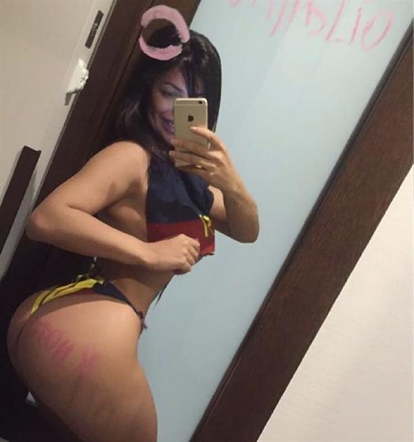 Suzy Cortez in a bikini taking a selfie