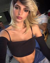 Emily Ratajkowski taking a selfie