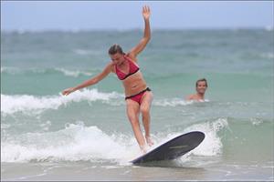 Daniela Hantuchova bikini beach surfing candids in Brisbane, Australia, December 26, 2012 
