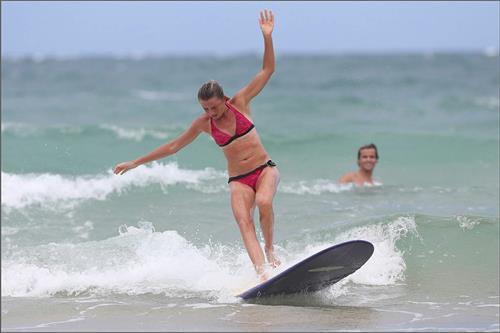 Daniela Hantuchova bikini beach surfing candids in Brisbane, Australia, December 26, 2012 