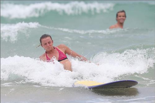 Daniela Hantuchova bikini beach surfing candids in Brisbane, Australia, December 26, 2012 