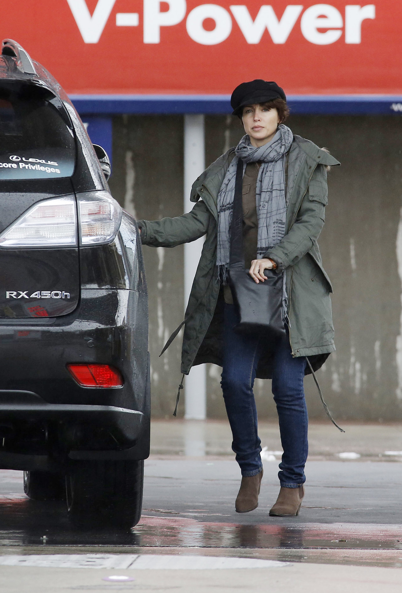 Dannii Minogue - Pictured getting a little wet while filling up on petrol - 09th August 2012