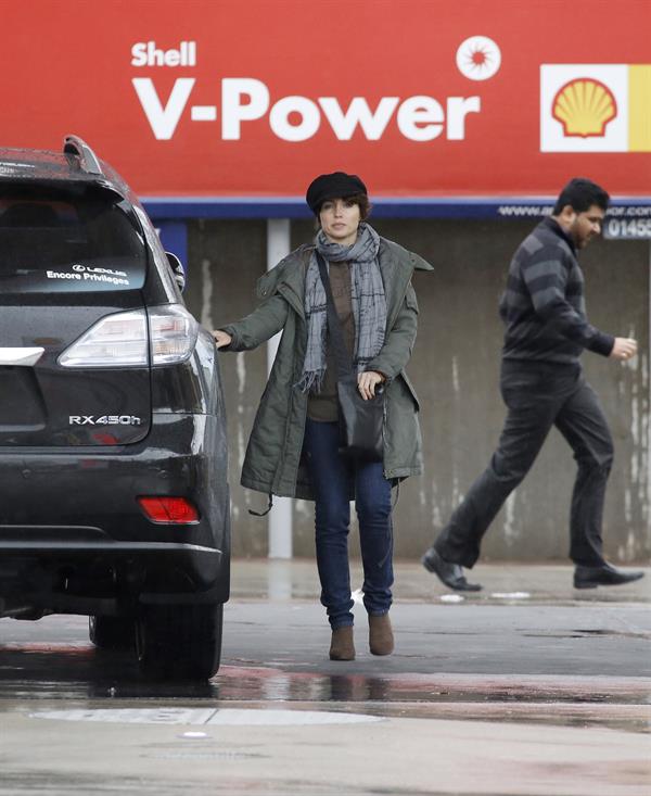 Dannii Minogue - Pictured getting a little wet while filling up on petrol - 09th August 2012