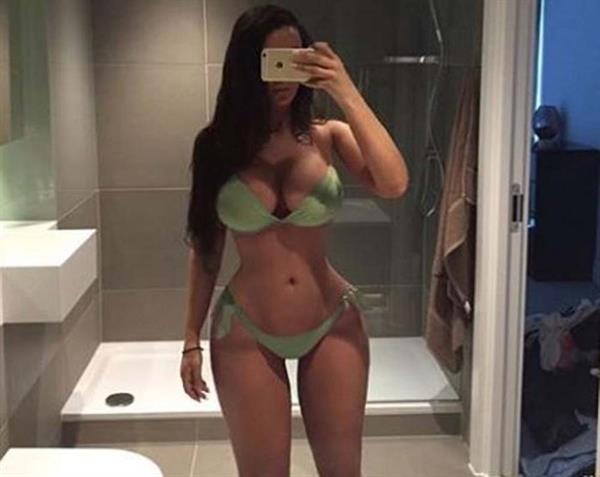 Ines Helene in a bikini taking a selfie