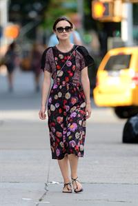 Keira Knightley wears a dark floral dress while strolling in New York City on August 7, 2012