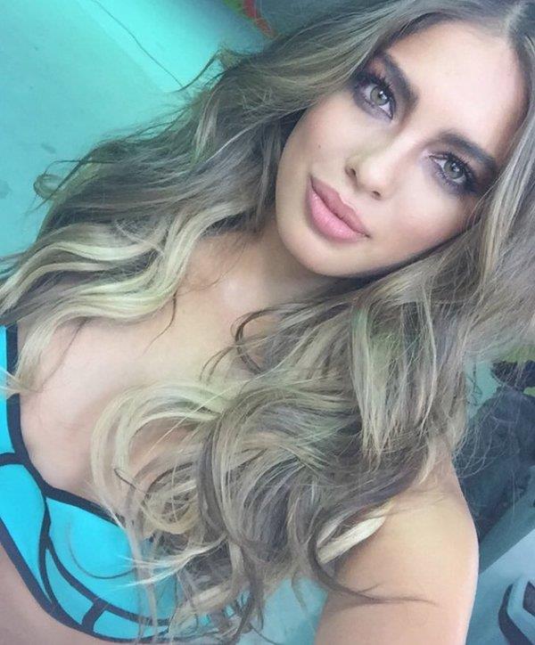Camila Avella in a bikini taking a selfie
