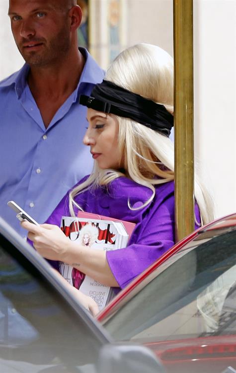 Lady Gaga holds her latest Vogue magazine cover September 2012 Issue close to her chest while out in New York City to visit a friend (07 August 2012).