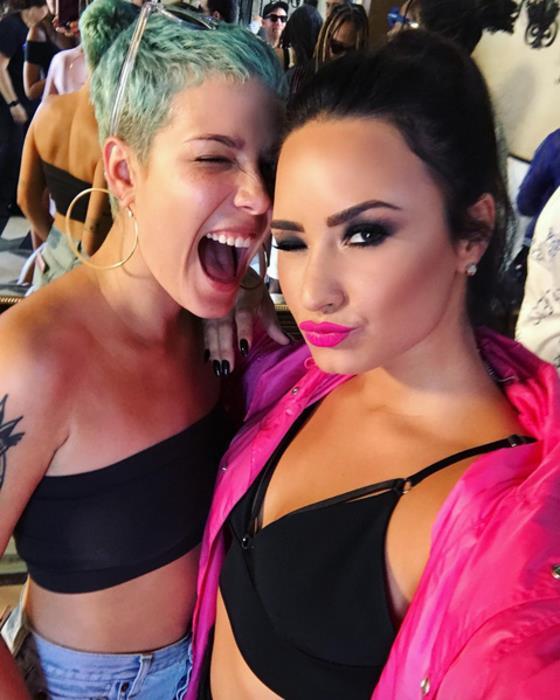 Demi Lovato in a bikini taking a selfie