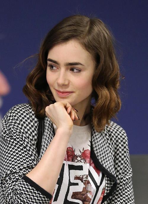 Lily Collins - LAX Airport 8/27/13