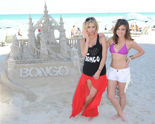 Lucy Hale Bikini Pictures Lucy Hale and Ashley Benson photoshoot at the Bondo Bikini Shack on Miami Beach on March 24, 2012