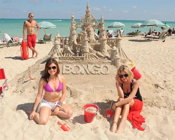 Lucy Hale and Ashley Benson photoshoot at the Bondo Bikini Shack on Miami Beach on March 24, 2012