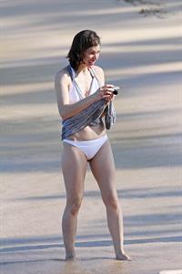 Milla Jovovich on the beach in a bikini on New Years Eve in Maui, Hawaii December 31, 2012 