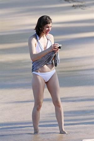 Milla Jovovich on the beach in a bikini on New Years Eve in Maui, Hawaii December 31, 2012 
