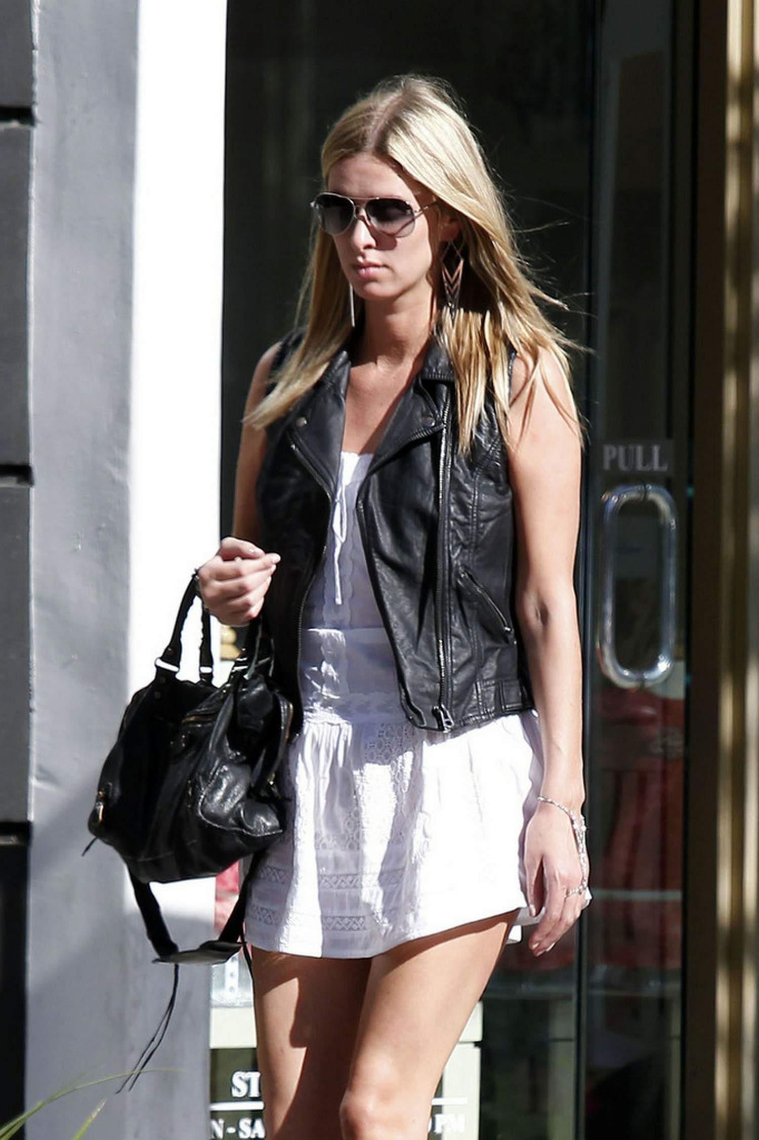 Nicky Hilton in a short white dress while shopping in Beverly Hills March 1, 2013 