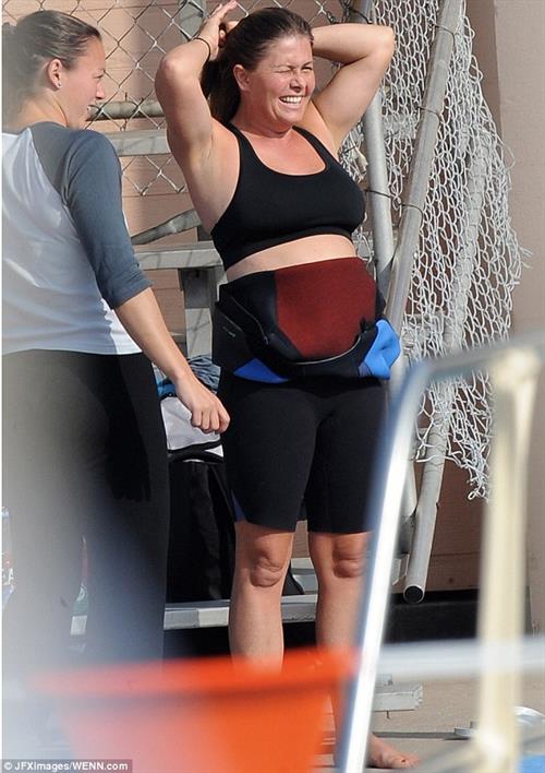 Nicole Eggert prepares for 'Splash' (sports bra/wetsuit) 6.2.2013 