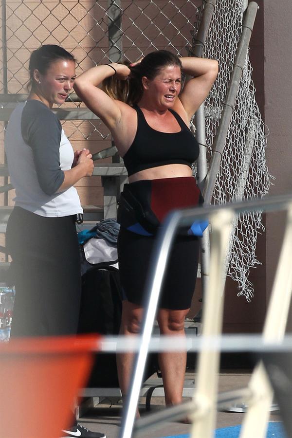 Nicole Eggert prepares for 'Splash' (sports bra/wetsuit) 6.2.2013 