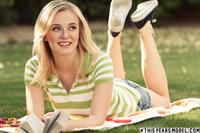 Ellie Jane naked reading in the park.