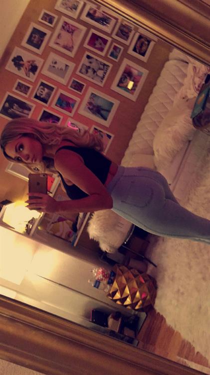 Lindsey Pelas taking a selfie and - ass