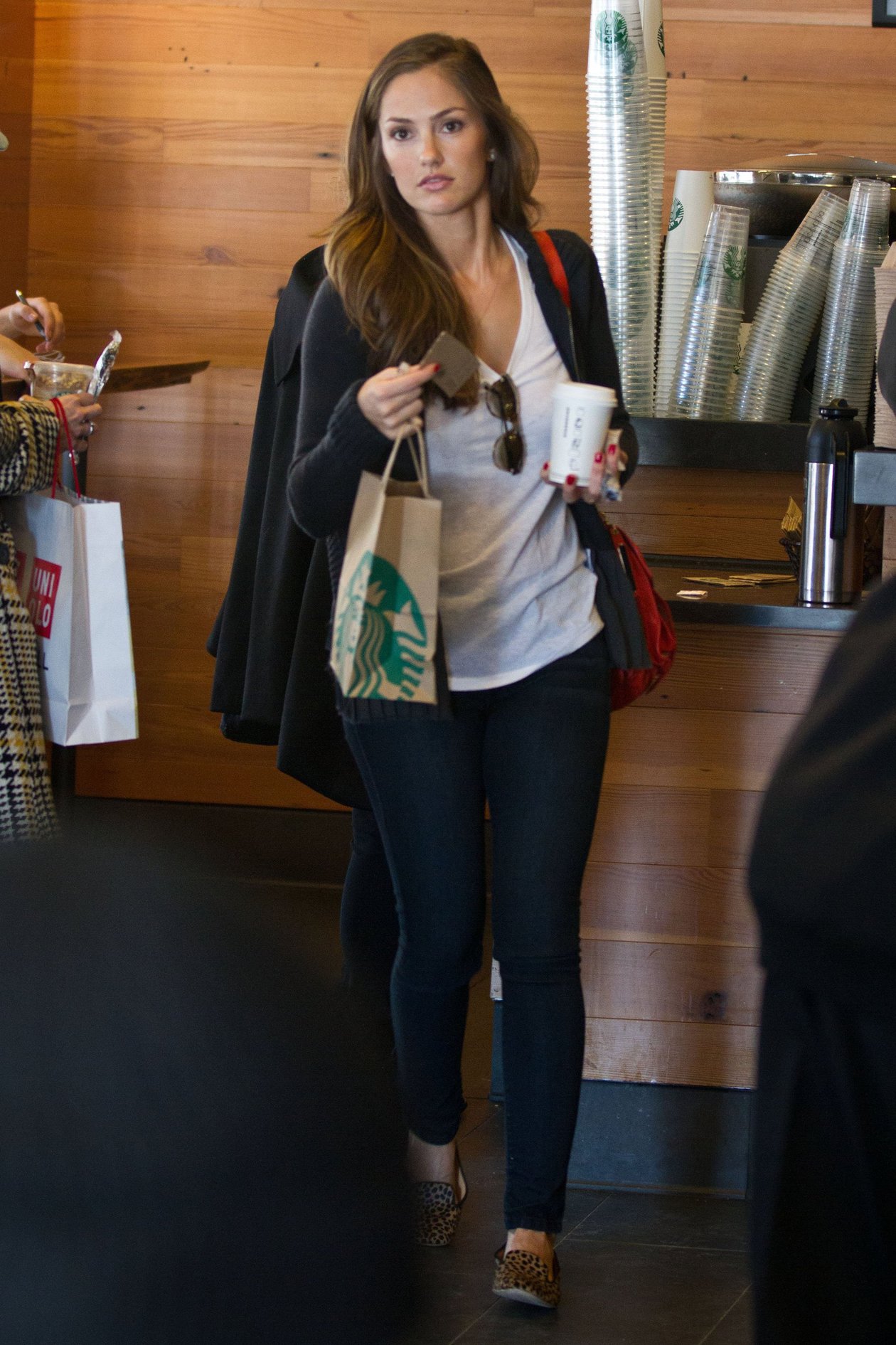 Minka Kelly outside her hotel with her morning Starbucks in New York City 8/2/2012 