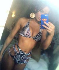 Rosie Mac in a bikini taking a selfie