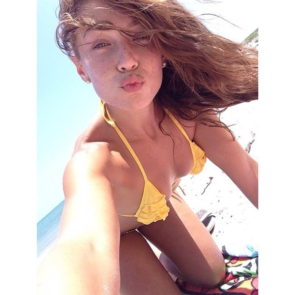 Nicole Mejia in a bikini taking a selfie