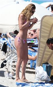 Doutzen Kroes enjoys a day on the beach in Miami Beach, FL on April 28, 2013