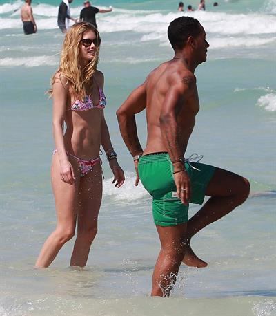Doutzen Kroes enjoys a day on the beach in Miami Beach, FL on April 28, 2013