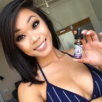 Nitda Cee in a bikini taking a selfie