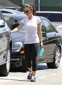 Minka Kelly leaving the gym in West Hollywood wearing a white shirt and black pants