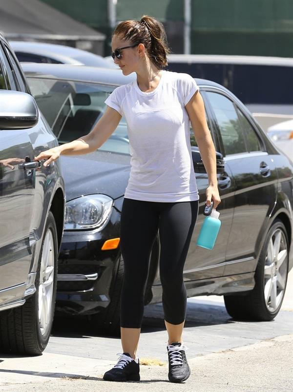 Minka Kelly leaving the gym in West Hollywood wearing a white shirt and black pants
