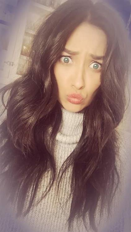 Shay Mitchell taking a selfie