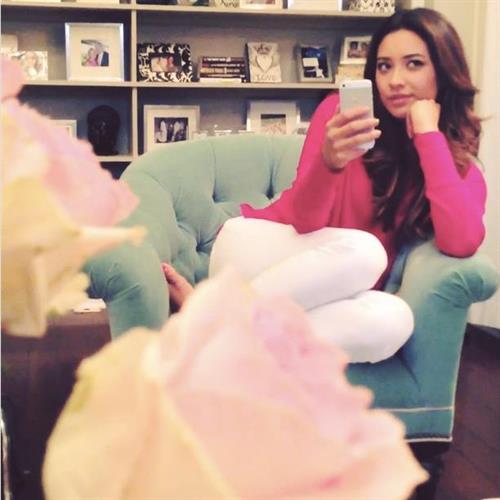 Shay Mitchell taking a selfie