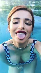 Bella Thorne in a bikini taking a selfie