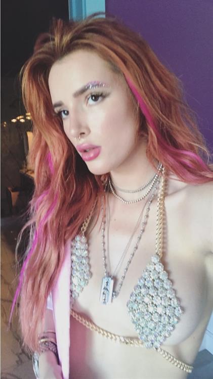 Bella Thorne in a bikini taking a selfie