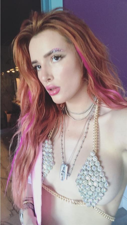 Bella Thorne in a bikini taking a selfie