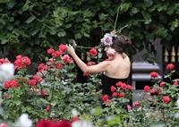 Natalie Portman modeling for a Miss Dior campaign photo shoot in the gardens of the Palais Royal in Paris 6/26/12 