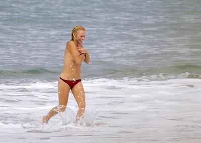 Pamela Anderson Pamela Anderson Going topless at the beach in France 02.10.13